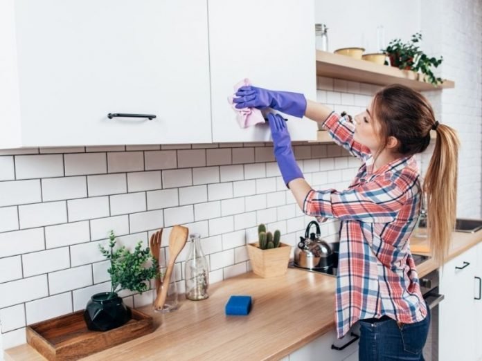 a girl cleaning her home